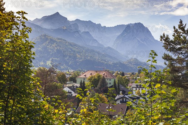 Wetterstein mountains with Alpspitze, Zugspitze massif and houses in the Partenkirchen district
