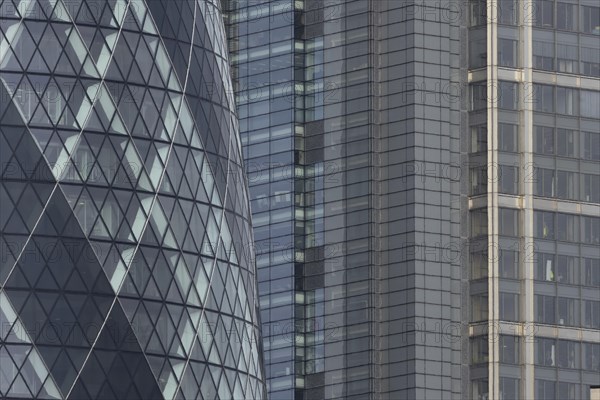 The Gherkin skyscraper building and nearby high rise office building, City of London, England,