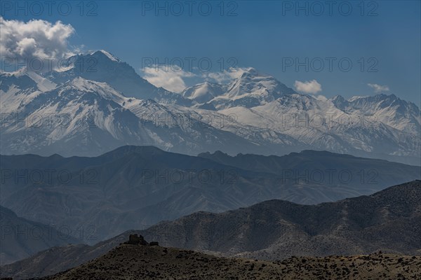 Old fortress in the desert landscape before the Annapurna mountain range, Kingdom of Mustang,
