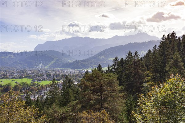 Wetterstein mountains with forest in autumn, hiking trail Kramerplateauweg, Garmisch-Partenkirchen,