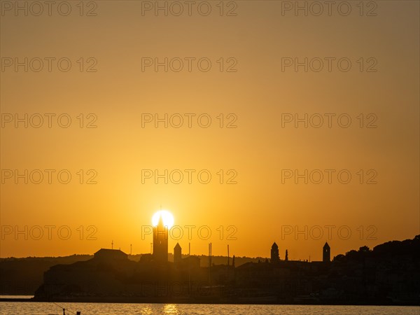 Sunset, silhouette of the church towers of Rab, town of Rab, island of Rab, Kvarner Gulf Bay,