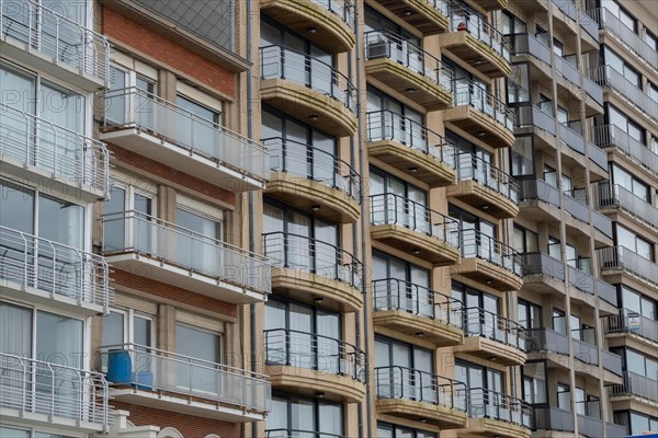 Close-up of a multi-storey building with balconies and brick facade, Blankenberge, Flanders,