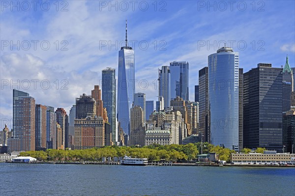 Skyline with skyscrapers in the Financial District, Battery Park in the foreground, One World Trade