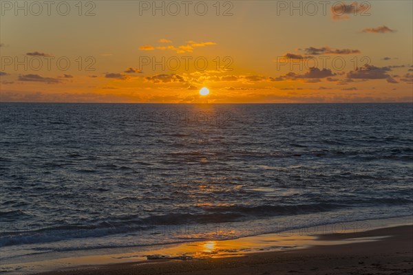 Dramatic sunset over the sea with radiant light and reflections on the water, Finikounda,
