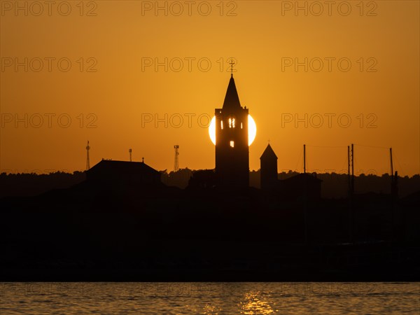 Golden evening light at sunset, silhouette of the church towers of Rab, town of Rab, island of Rab,