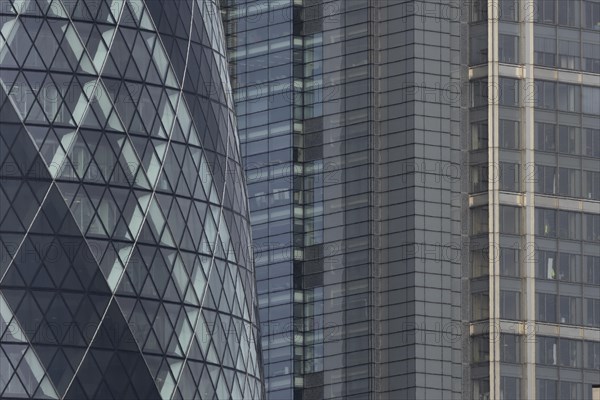 The Gherkin skyscraper building and nearby high rise office building, City of London, England,