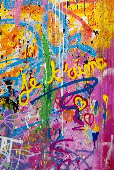 Street art, painted house wall with hearts and lettering on the theme of love, Montmartre, Paris,