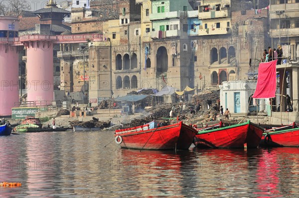 Boat in front of the ghats of a river in India, where laundry is hung out to dry, Varanasi, Uttar