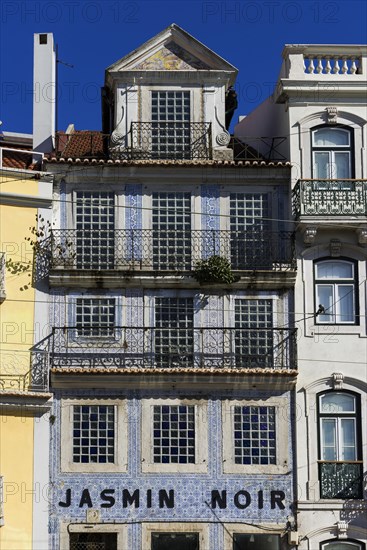 Old building, facade with typical azulejos, house facade, tiles in the old town, city,