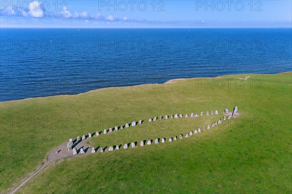 Aerial view over Ale's Stones, Ales stenar, megalithic stone oval monument representing stone ship