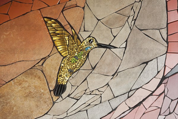 Wall mosaic with hummingbird in flight by Isidora Paz Lopez 2019, one, yellow, golden, flight, bird