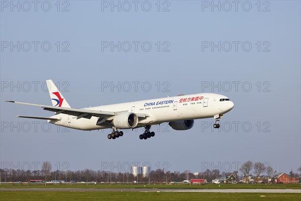 China Eastern Airlines Boeing 777-39P (ER) with registration B-2023 approaching the Polderbaan,