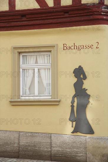 House wall with figure at the historic Malerwinkelhaus built in 1774 and museum, female figure,