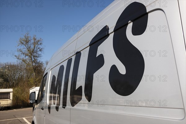 On Milf's modified lettering on a van of the car sharing provider Miles, Duesseldorf, Germany,