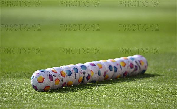 Adidas Derbystar match balls lie in a row on the pitch, Voith-Arena, Heidenheim,