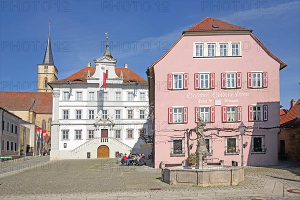 Baroque town hall, Goldene Krone inn, street pub, Marienbrunnen fountain and steeple of St Vitus