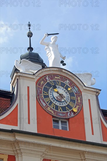 Pediment and clock with zodiac signs and Justitia with decorations on the baroque town hall, zodiac