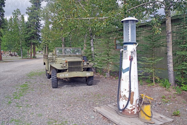 Jeep and petrol station from the 1940s, old US Army camp, Yukon Discvery Lodge, Alaska Highway,