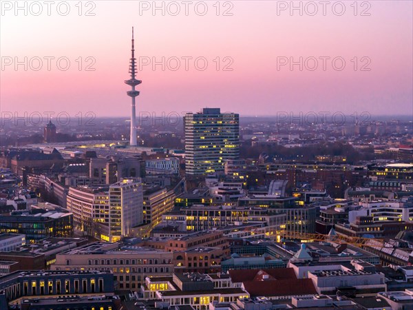 Aerial view at blue hour Heinrich Hertz television tower with exhibition centre, Hamburg, Germany,