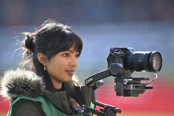 Stadium TV, camerawoman, Sony camera on Ronin rig, logo, Voith-Arena, Heidenheim,