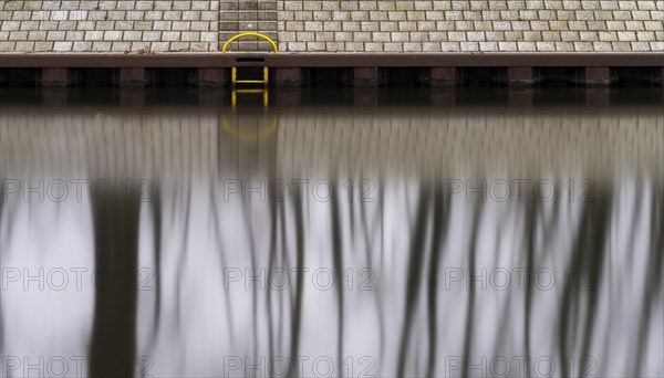 Long exposure, reflection of trees in the water of the Spree, Am Schleusenkanal, Berlin, Germany,