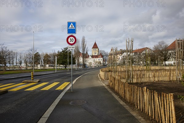 Quai de Belgique with zebra crossing and view towards Ouchy Castle in the Ouchy district, Lausanne,