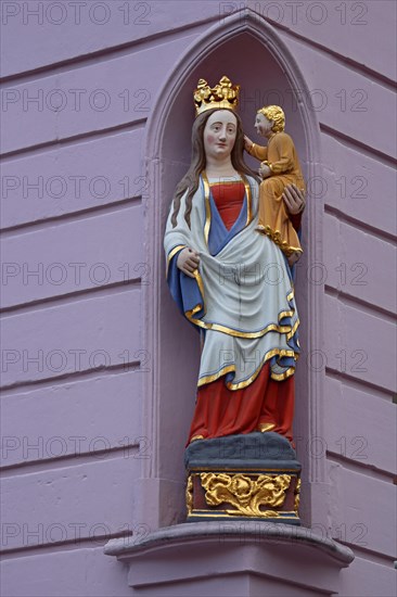 Madonna figure with baby Jesus and golden crown on the corner of the Hauptwache building,