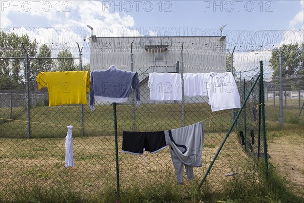 Laundry hanging to dry on a washing line in the central contact point for asylum seekers in the