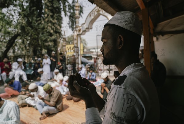 Muslim devotees offer the first Friday prayers of the holy month of Ramadan at a Mosque, on March