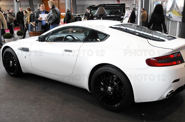 RETRO CLASSICS 2010, Stuttgart Messe, Side view of a white Aston Martin sports car at a trade fair,