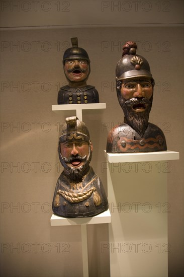 Display of old open mouthed gaper heads traditionally used to identify a pharmacy in Holland,