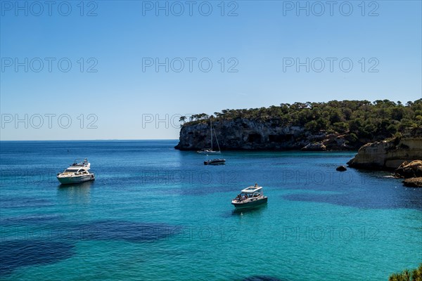 Private boats anchored in the bay in front of Playa El Mago, Cala de Portals Vells, Majorca,