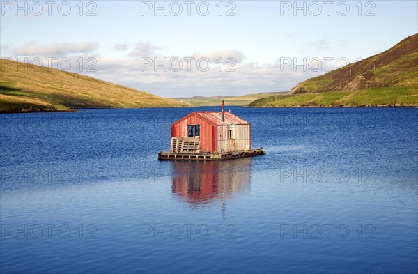 Fisherman's shed on small island, Olna Firth, Voe, Shetland Islands, Scotland, United Kingdom,