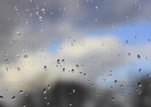 Raindrops on a window pane, North Rhine-Westphalia, Germany, Europe