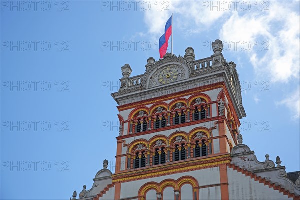 Tower with decorations and flag of St Matthias Church, Benedictine Abbey, Trier,