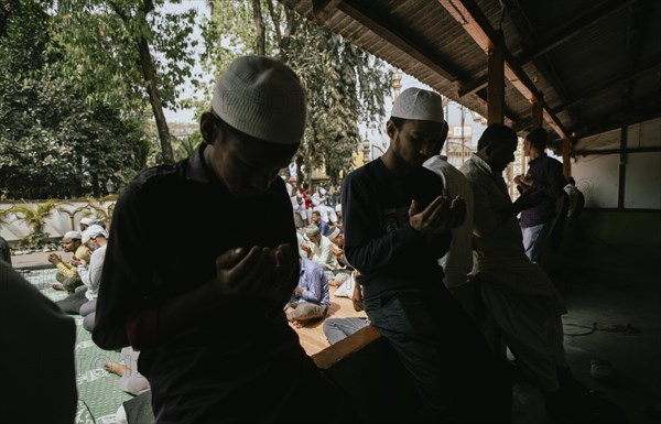 Muslim devotees offer the first Friday prayers of the holy month of Ramadan at a Mosque, on March