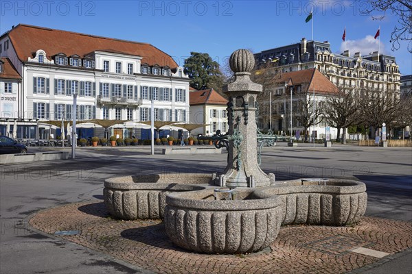 Fountain Place du Vieux-Port and in the background the Hotel Angleterre et Residence and