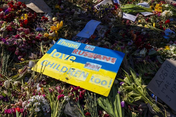 Mourners with flags and flowers in front of the Russian Embassy Unter den Linden, Berlin, Germany,