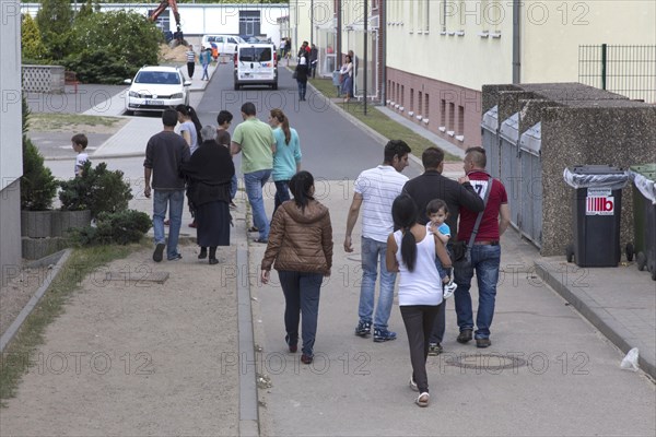 Refugees at the central contact point for asylum seekers in Brandenburg, Eisenhuettenstadt, 3 June