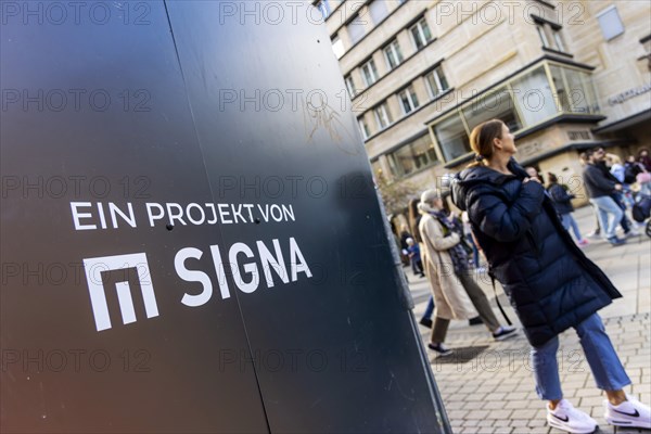 Construction fence in Stuttgart city centre with the Signa Real Estate logo. Rene Benko's property