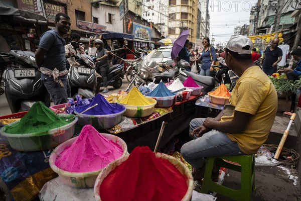 Vendor sells Holi celebration items in a street market, ahead of Holi festival on March 23, 2024 in