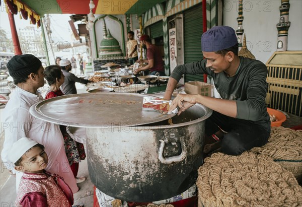 People buy food at a stall to break their fast during the holy month of Ramadan, on March 15, 2024