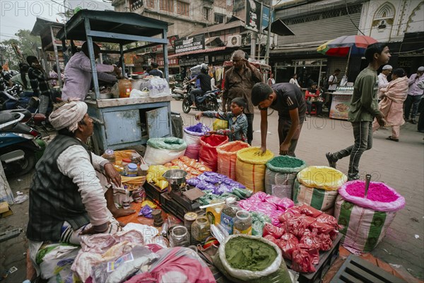 Vendor sells Holi celebration items in a street market, ahead of Holi festival on March 23, 2024 in