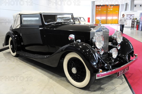RETRO CLASSICS 2010, Stuttgart Messe, Side view of a black Rolls-Royce convertible, symbolising