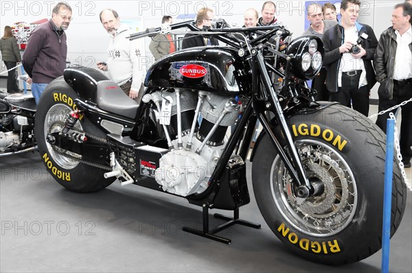 RETRO CLASSICS 2010, Stuttgart Messe, A black motorbike with RIGDON tyres is viewed by people at a