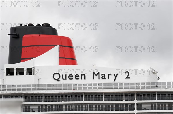 View of the funnel of the Queen Mary 2 cruise ship against a cloudy sky, Hamburg, Hanseatic City of