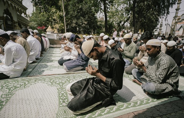 Muslim devotees offer the first Friday prayers of the holy month of Ramadan at a Mosque, on March