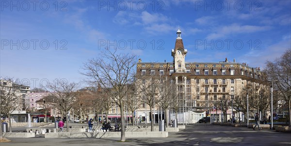 Magnificent facade and clock tower on Place de la Navigation in the Ouchy neighbourhood, Lausanne,