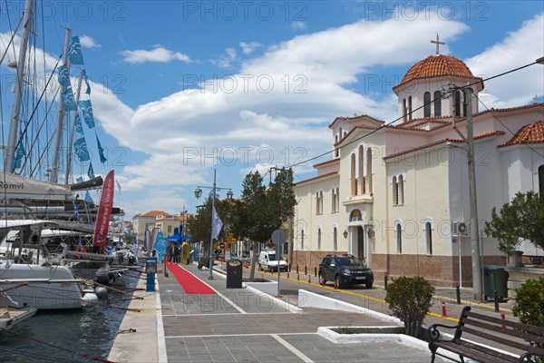 A picturesque harbour view with a church, yachts and a promenade under a blue sky, Promenade, Holy
