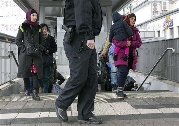 Refugees arriving at Rosenheim station, being taken to registration by federal police officers,